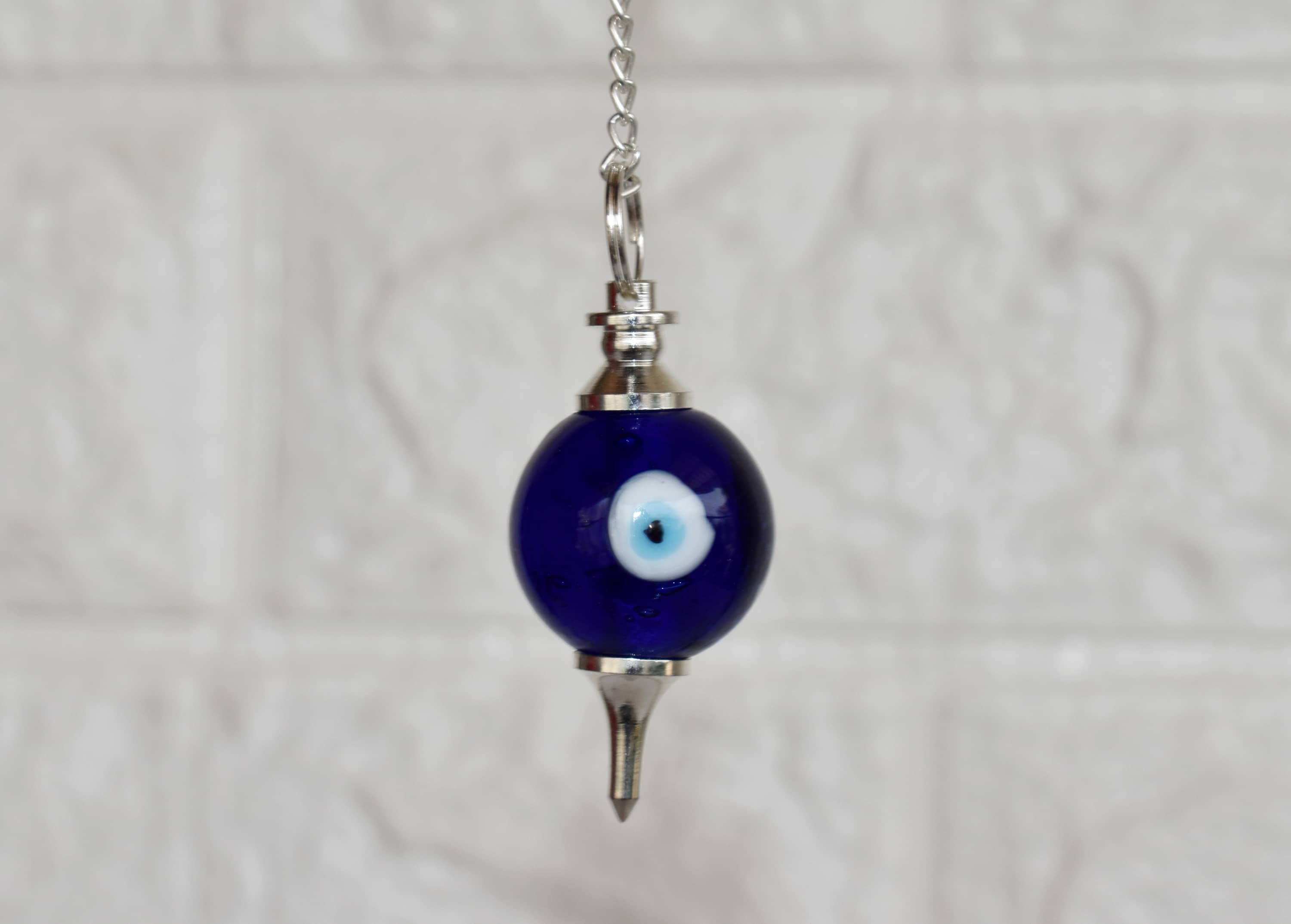 Evil Eye Crystal Pendulum – Protection & Intuitive Guidance Tool