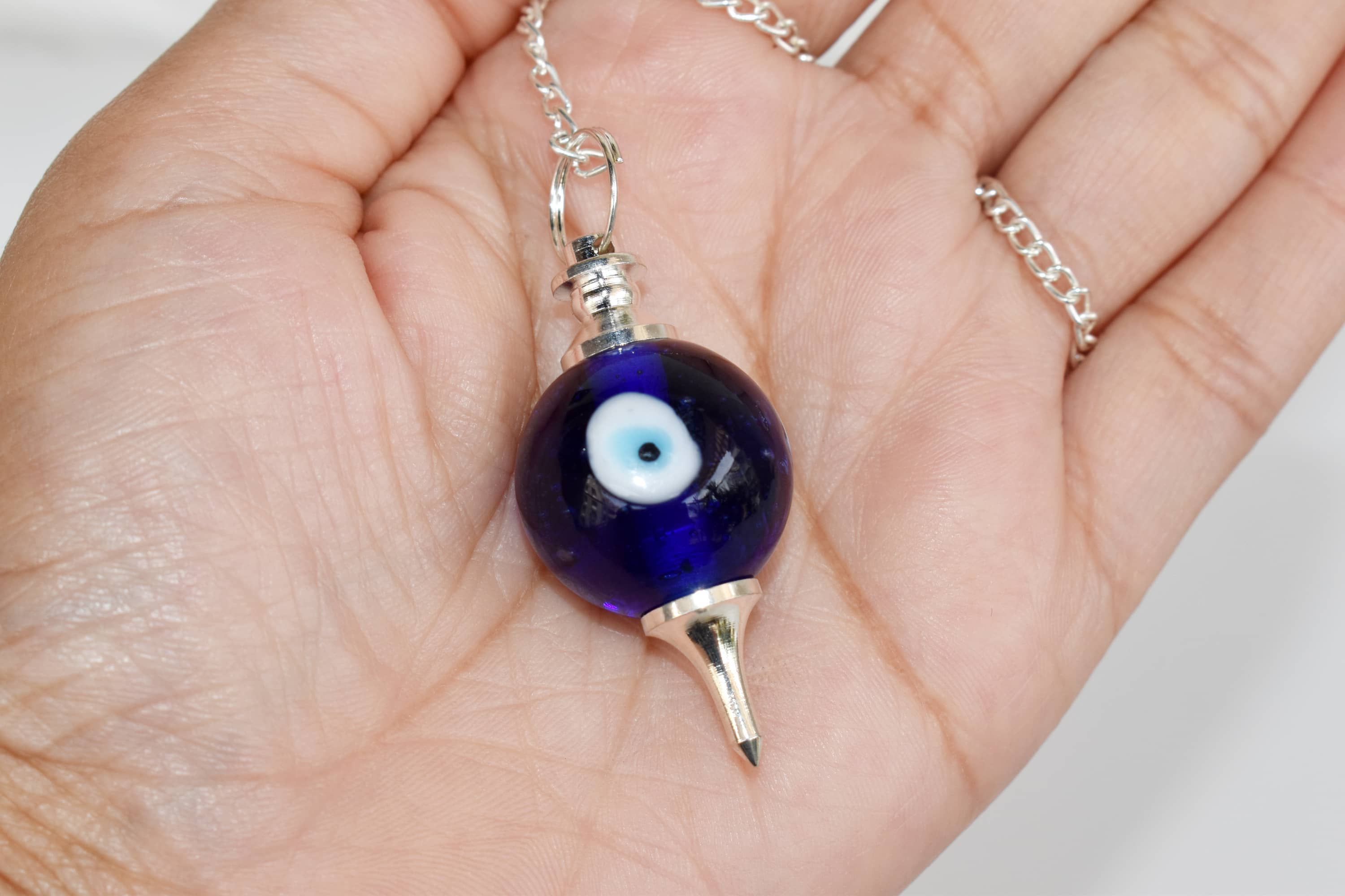 Evil Eye Crystal Pendulum – Protection & Intuitive Guidance Tool