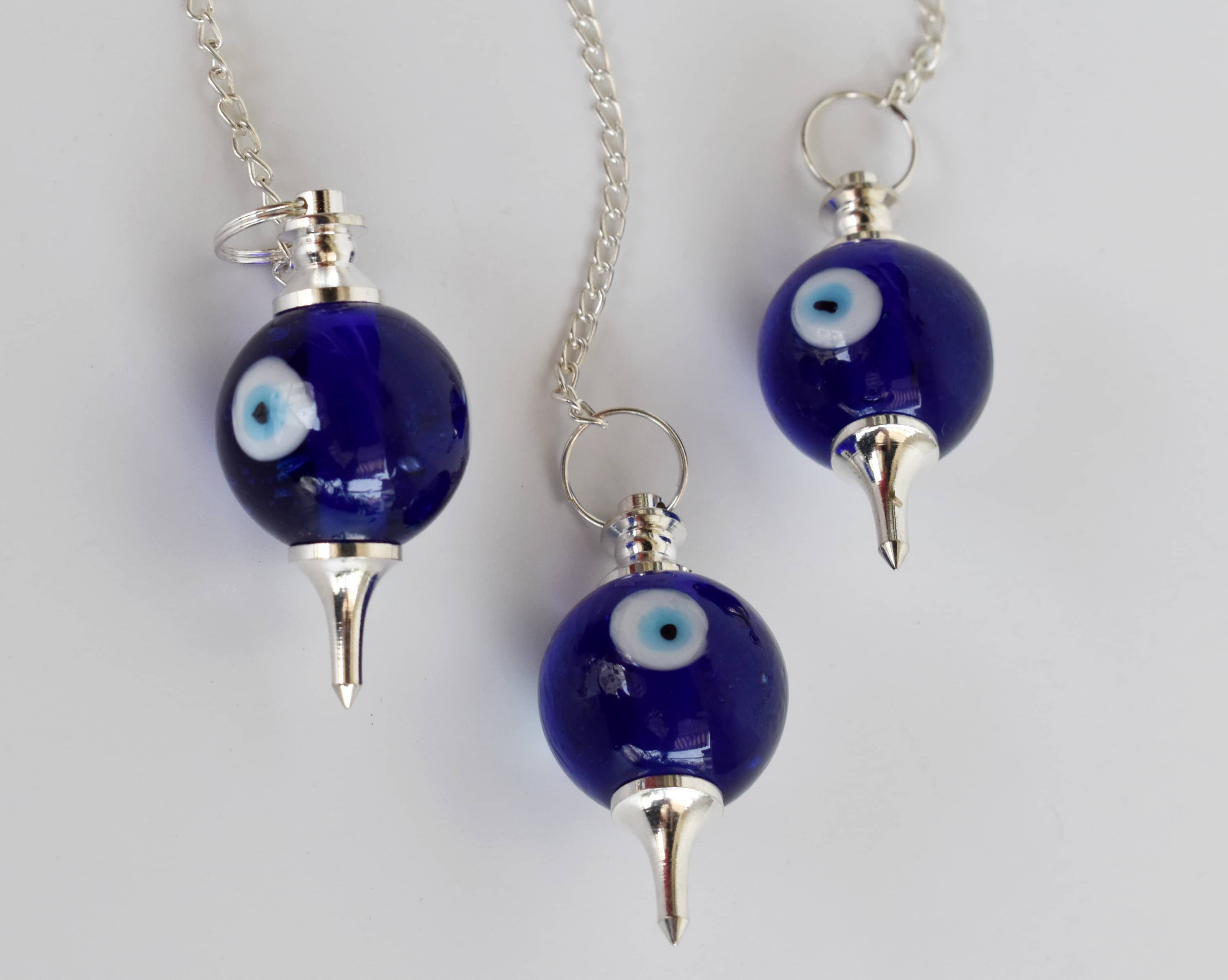 Evil Eye Crystal Pendulum – Protection & Intuitive Guidance Tool